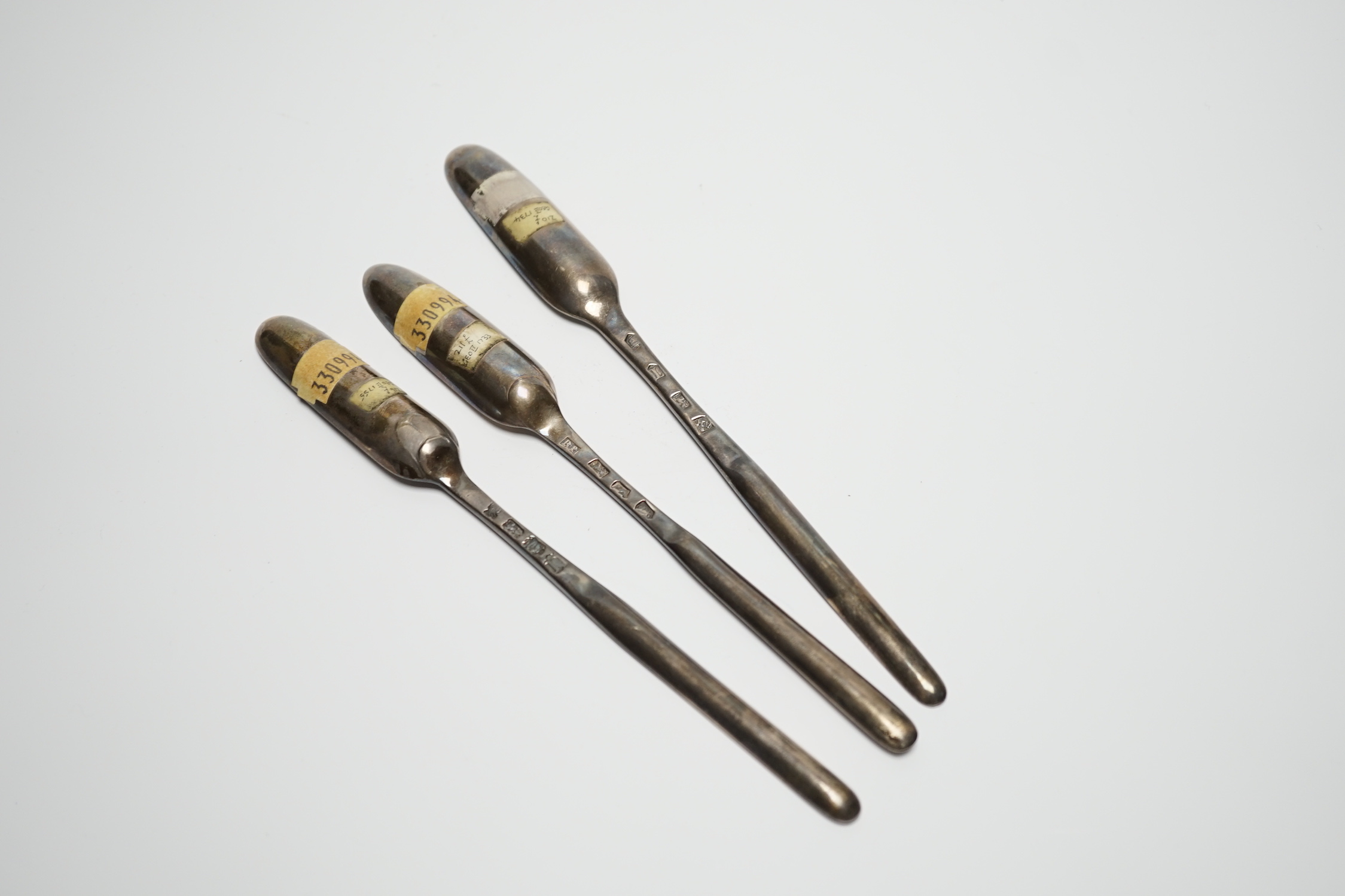 Three George II silver marrow scoops, Richard Pargeter, London, 1733, 20.7cm, Ann Hill, London, 1734 and Ebeneezer Coker?, London, 1755.